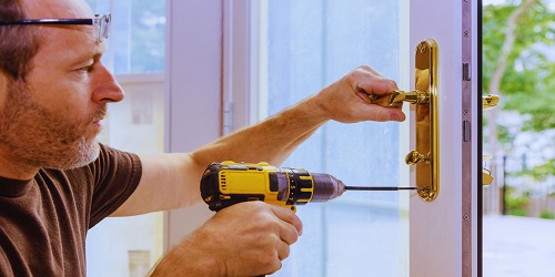 Expert locksmith in OKC installing a high-security lock
