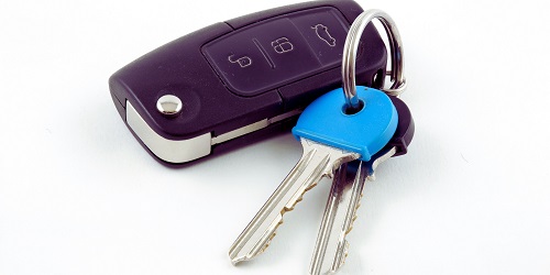 Automotive locksmith in Tulsa unlocking a car door