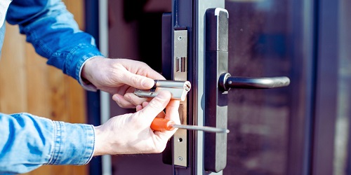 Expert locksmith in OKC installing a high-security lock